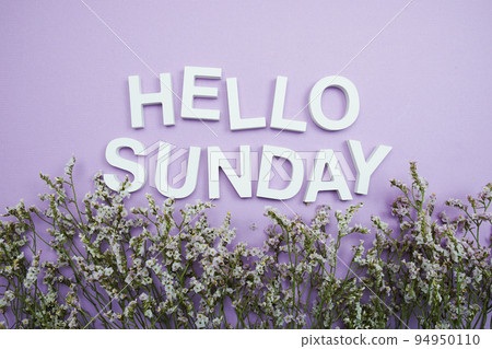 Hello Sunday alphabet letters with flower frame on purple background 94950110