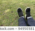 person relaxing on the lawn 94950381
