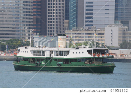 Star ferry sailing through Victoria Bay in Hong Kong 94951532