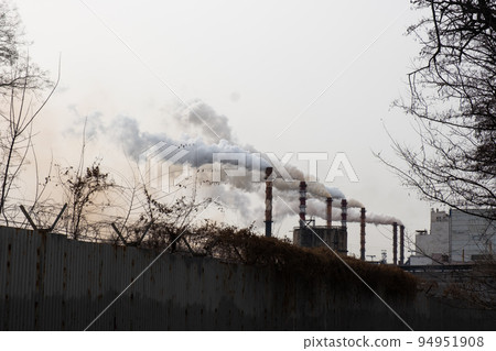 Smoke from the chimneys at the factory. Environmental pollution. 94951908