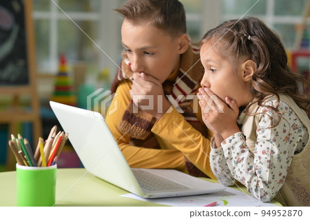 Portrait of brother and sister use laptop Portrait of brother and sister use laptop 94952870