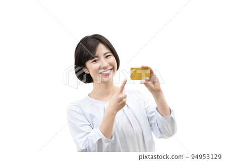 A young woman with a credit card 94953129