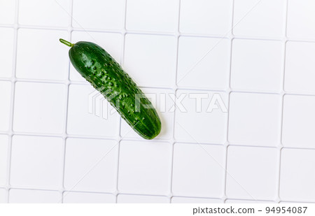 Green fresh cucumber for salad isolated on white Green fresh cucumber for salad isolated on white 94954087