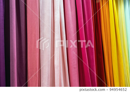 samples of cloth and fabrics in different colors found at a fabrics market 94954652