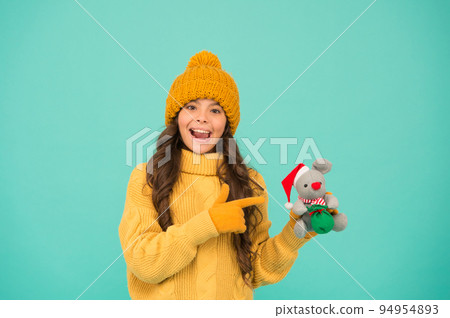 Pleasant shopping. child knitted warm outfit play with toy rat. toy shop for kids. buy christmas presents. being in xmas mood. happy new 2020 year. mouse symbol of year. little girl hold mouse toy Pleasant shopping. child knitted warm outfit play with toy rat. toy shop for kids. buy christmas presents. being in xmas mood. happy new 2020 year. mouse symbol of year. little girl hold mouse toy 94954893