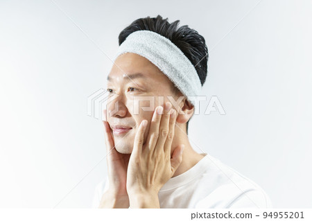 A man doing skin care A man doing skin care 94955201