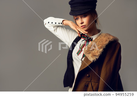 Fashion Model in the studio. Beautiful Sexy Woman In Stylish Fashionable Fall Clothes. Fashion Model in the studio. Beautiful Sexy Woman In Stylish Fashionable Fall Clothes. 94955259