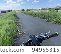 cycling along the river 94955315