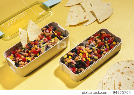 cowboy caviar, texas caviar with black bean, tomatoes, avocado, red bell pepper, corn in lunch box cowboy caviar, texas caviar with black bean, tomatoes, avocado, red bell pepper, corn in lunch box 94955704