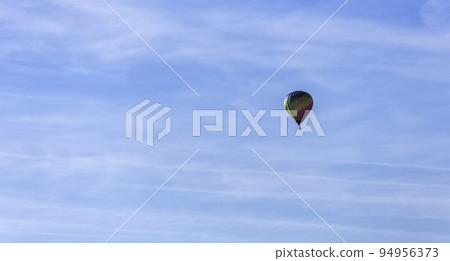 Hot air balloons over French fields Hot air balloons over French fields 94956373