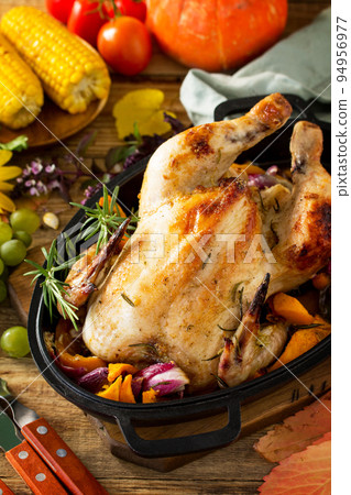 Christmas or Thanksgiving Homemade Roasted Turkey with Pumpkin on rustic background. Christmas or Thanksgiving Homemade Roasted Turkey with Pumpkin on rustic background. 94956977
