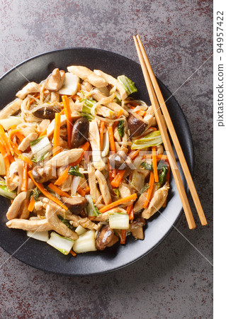 Chop Suey Chicken Stir Fry with vegetables close-up in a plate. Vertical top view Chop Suey Chicken Stir Fry with vegetables close-up in a plate. Vertical top view 94957422