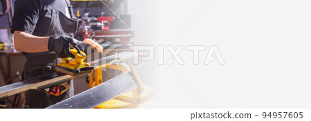 Banner repair, people copy space - mechanic, man is rubbing a ski Banner repair, people copy space - mechanic, man is rubbing a ski 94957605