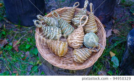 old-time straw-woven toys, home-made handicrafts. for performing rituals. put together a wicker basket 94958329