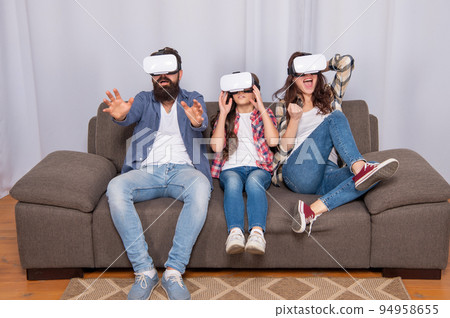 emotional parents with kid spend time together in vr glasses at home, innovation 94958655
