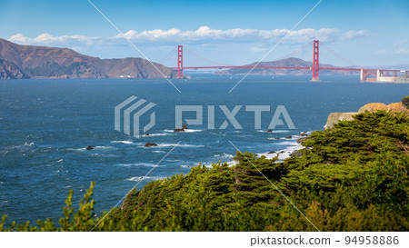 Golden Gate bridge over sea horizon from Baker beach. Golden Gate bridge over sea horizon from Baker beach. 94958886