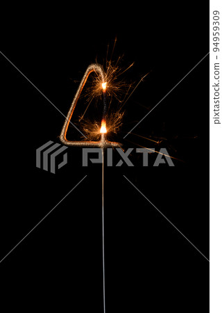 Burning golden sparkler in shape of number four, digit 4, isolated on black background Burning golden sparkler in shape of number four, digit 4, isolated on black background 94959309