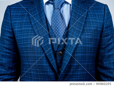 Matching tie with suit. Blue suit worn with classic tie. Necktie collection. Fashion mens accessory. Formal style. Business meeting. Polka dots will brighten up your office attire 94960205