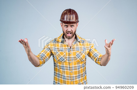 mature builder in shirt. unshaven man on construction site. handsome building worker in hard hat. labor day. angry guy wear safety helmet solve problem. engineer on work. male lifestyle 94960209