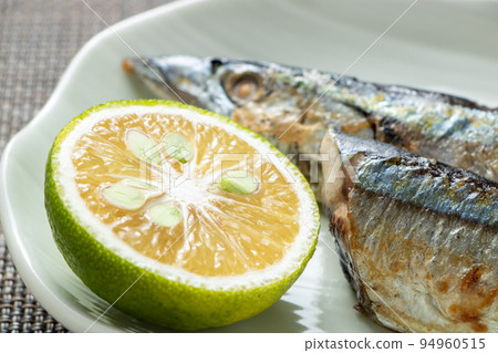 Kabosu (cut) served with salt-grilled Pacific saury. Kabosu (cut) served with salt-grilled Pacific saury. 94960515