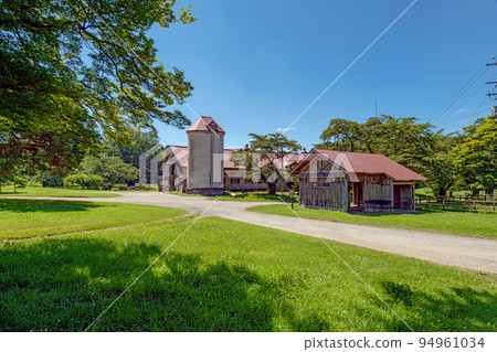 Iwate Koiwai Farm Summer scenery of cow barn and silo Iwate Koiwai Farm Summer scenery of cow barn and silo 94961034