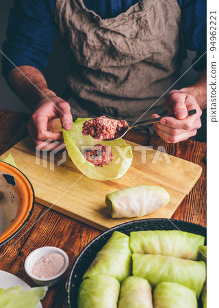 Chef Cooking White Cabbage Stuffed with Ground Meat Chef Cooking White Cabbage Stuffed with Ground Meat 94962221
