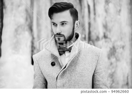Outdoor portrait of handsome man in gray coat Outdoor portrait of handsome man in gray coat 94962660