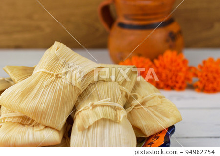 Mexican cuisine tamales, atole, and marigolds inspired by the Day of the Dead 94962754