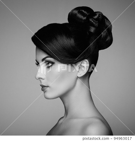 Fashion portrait of young beautiful woman with elegant hairstyle Fashion portrait of young beautiful woman with elegant hairstyle 94963017