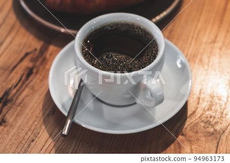 Black coffee. White cup of filter coffee Black coffee. White cup of filter coffee 94963173