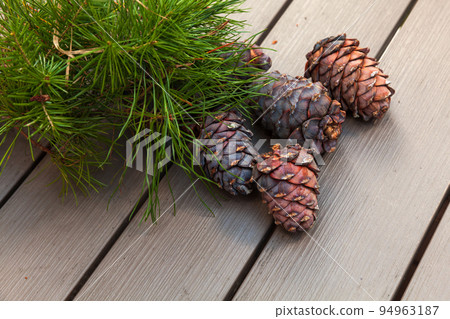 Siberian pine tree branch and cones lay on a table, Siberian pine tree branch and cones lay on a table, 94963187