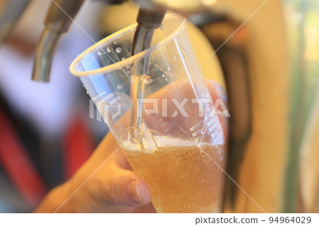 Beer poured from the tap, craft beer, draft beer 94964029