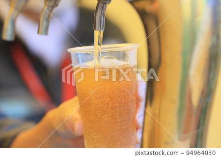 Beer poured from the tap, craft beer, draft beer 94964030
