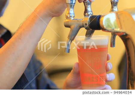 Beer poured from the tap, craft beer, draft beer 94964034