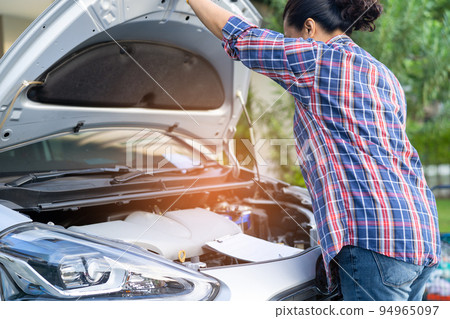Open hood mechanic engine system to check and repair damage car crash. Open hood mechanic engine system to check and repair damage car crash. 94965097