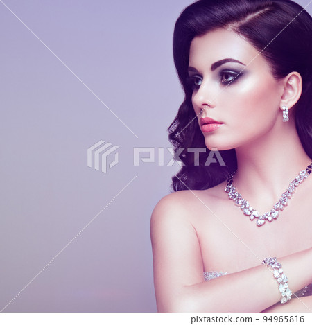 Brunette woman with long shiny wavy hair 94965816