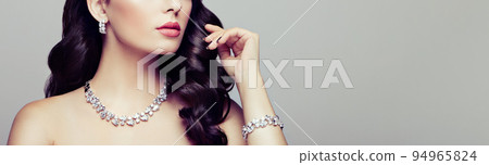 Brunette woman with long shiny wavy hair 94965824