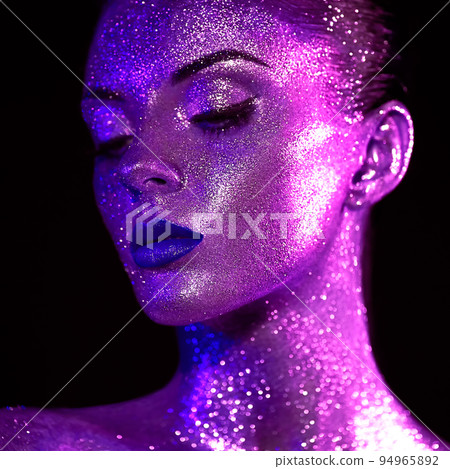 Portrait of beautiful woman with sparkles on her face Portrait of beautiful woman with sparkles on her face 94965892