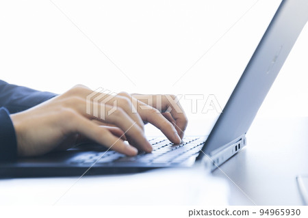 Male hand typing 94965930