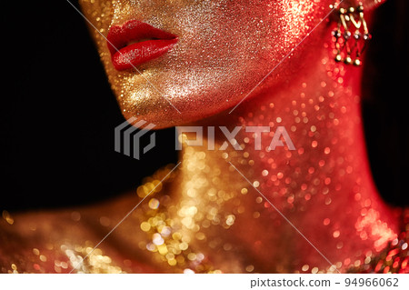 Portrait of beautiful woman with sparkles on her face 94966062