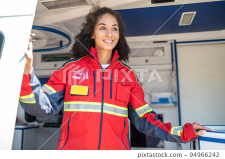 Smiling happy healthcare worker in the EMS vehicle 94966242