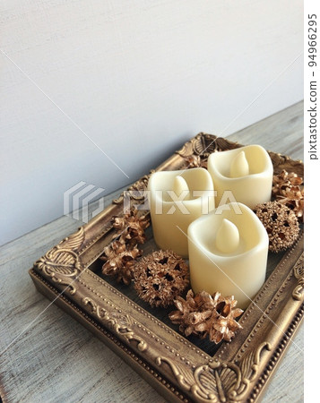 antique gold picture frame and candle 94966295