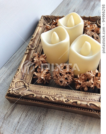 antique gold picture frame and candle 94966298
