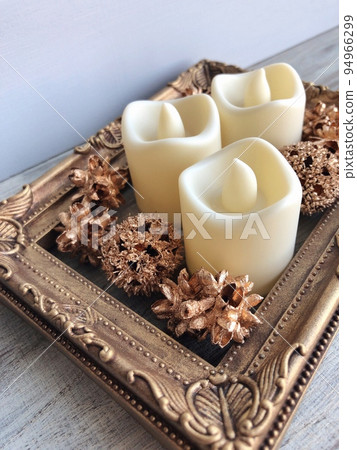 antique gold picture frame and candle 94966299