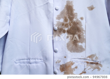 dirty sauce stain on white shirt from eating in home of daily life activity. dirty stains for cleaning concept. dirty sauce stain on white shirt from eating in home of daily life activity. dirty stains for cleaning concept. 94967808