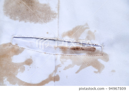 dirty sauce stain on white shirt from eating in home of daily life activity. dirty stains for cleaning concept. 94967809
