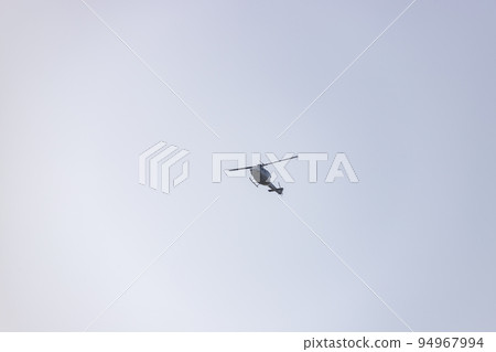 Helicopter. Spanish Air Force rehearsing for the National Day of October 12 through the streets of the city of Madrid. MADRID, SPAIN - OCTOBER 5, 2022. Helicopter. Spanish Air Force rehearsing for the National Day of October 12 through the streets of the city of Madrid. MADRID, SPAIN - OCTOBER 5, 2022. 94967994