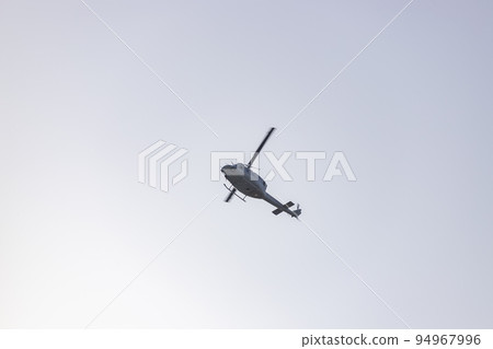 Helicopter. Spanish Air Force rehearsing for the National Day of October 12 through the streets of the city of Madrid. MADRID, SPAIN - OCTOBER 5, 2022. Helicopter. Spanish Air Force rehearsing for the National Day of October 12 through the streets of the city of Madrid. MADRID, SPAIN - OCTOBER 5, 2022. 94967996