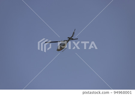 Helicopter. Spanish Air Force rehearsing for the National Day of October 12 through the streets of the city of Madrid. MADRID, SPAIN - OCTOBER 5, 2022. 94968001