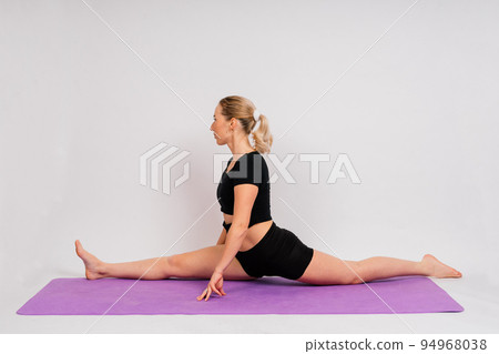 Sporty girl doing exercise with dumbbells, silhouette studio shot over dark and whitebackground 94968038